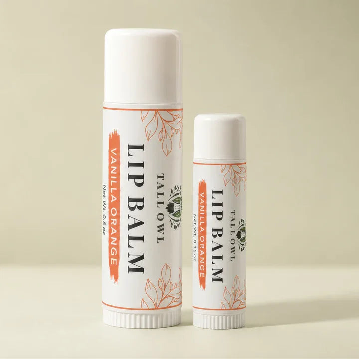 Vanilla Orange Lip Balm in 0.15 oz and 0.5 oz tubes side by side