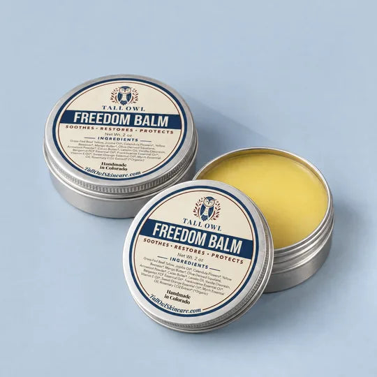 Tall Owl Freedom Balm, 2 oz tin open to show the balm, with its lid