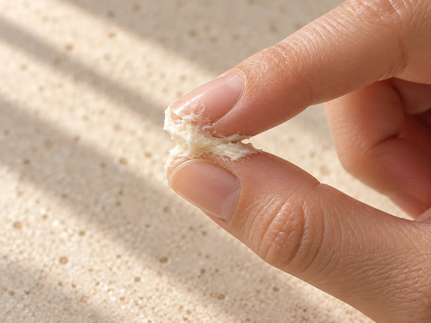 A small amount of Whipped Tallow warming between fingertips